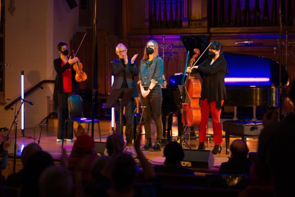 Inés Voglar Belgique, Jeff Payne, and Nancy Ives with composer Margot Pullen at Fear No Music's eighth Locally Sourced Sounds concert in 2022. Photo by Douglas Detrick.