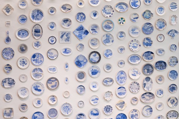 arrangement of regular rows of blue and white plates from Julie Green's Last Supper series
