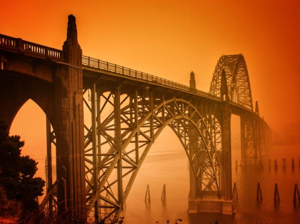Benjie King shot the Yaquina Bay Bridge in the smoky glow caused by wildfire. "You won’t see the sky like that again, hopefully, ever again,” he says. Photo by: Benjie King, Out West Photography