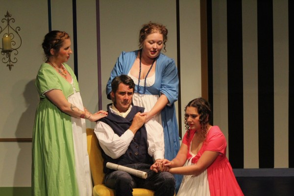 Mr. Bennet (played by Daric Moore) is consoled by family members (from left) Jane (Amanda Westphal), Mrs. Bennet (Megan Reed), and Lizzy (Ali Bean) in "Pride and Prejudice." The romantic comedy continues Fridays through Sundays through Aug. 13 at Gallery Theater in McMinnville. Photo courtesy: Gallery Theater