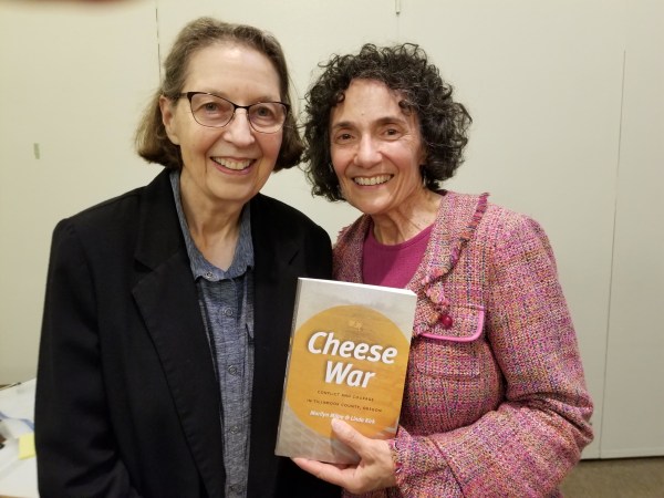 Sisters Linda Kirk (left) and Marilyn Milne wrote “Cheese War“ to add to the historic record and try to figure out what the fight was about.