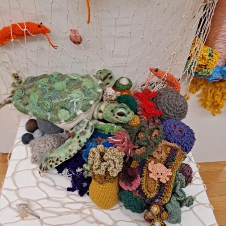 The coral reef created by Christina Harkness and Shanna Smith Suttner goes beyond fish to include turtles, crabs, and other ocean life. “I want to show the entire ecosystem around corals and what everything is as far as the coral reef,” Harkness says. Photo courtesy: Christina Harkness