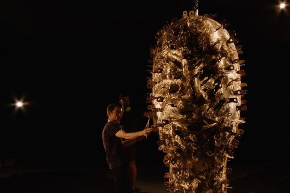 Andy Akiho playing one of Jun Kuneko's sculptures. Photo courtesy of Oregon Symphony and the composer.