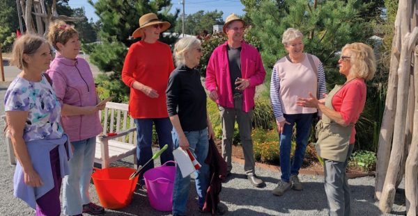 In pre-COVID days, Ketzel Levine (far right) leads a discussion in the Wonder Garden. She says the garden has become the No. 1 gathering place in Manzanita for people who wanted to get together in masks. Photo courtesy: Ketzel Levine