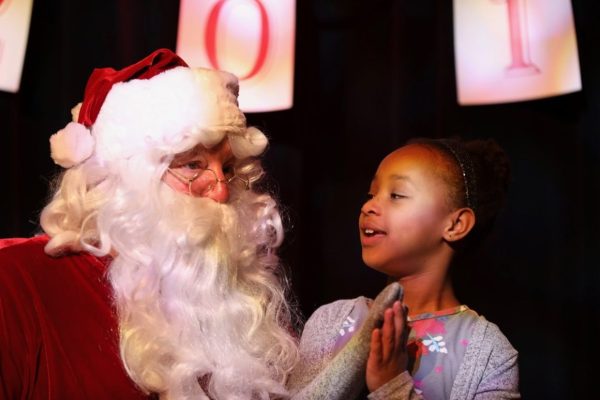 Belle Kea has a heart-to-heart with Santa during last year’s holiday celebration at the Lincoln City Cultural Center. Photo courtesy: Lincoln City Cultural Center