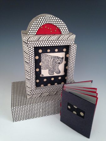 Margo Klass’ “Ursa Major: The Great Bear in the Sky” is a mixed media piece including a tacket-bound (exposed binding) book in box casement with sliding door and base.