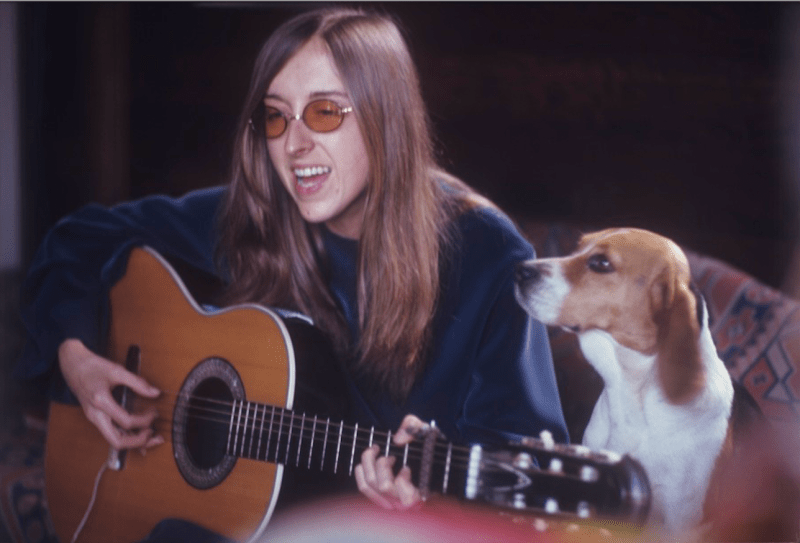 Judee Sill with guitar and dog, February 1971. Photo: Greenwich Entertainment